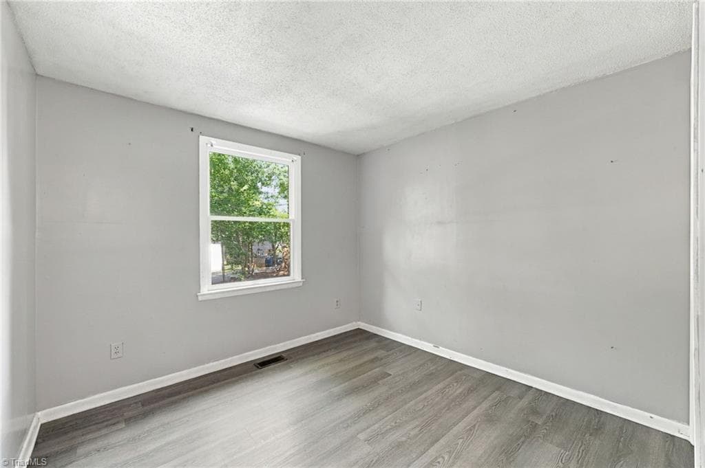 Second bedroom on the second floor area of the home. - 5500 Richland Street # A, Greensboro NC 27409, Greensboro