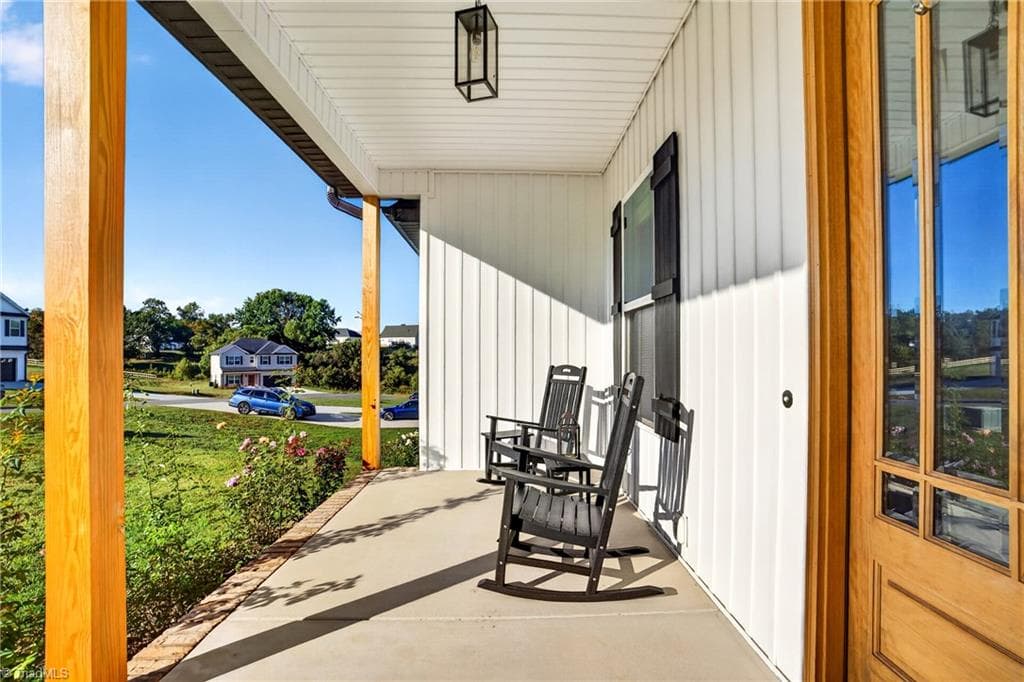 Porch views across open green lawn - 117 Scenic View Trail, Madison NC 27025, Madison