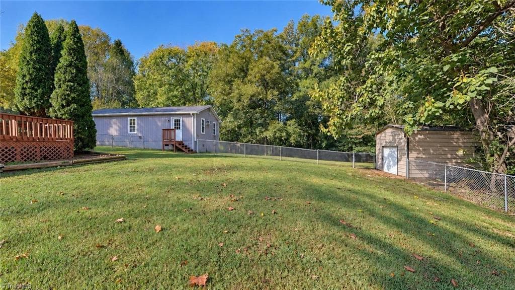 Another view of the yard, with a view of the two outbuilding on the property - 1823 Bantry Trail, Kernersville NC 27284, Kernersville