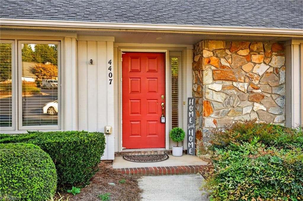 A cheerful front entry sets the tone before you ever step inside. - 4407 Cove Cay Lane, Greensboro NC 27410, Greensboro