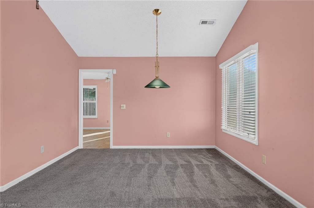 A flexible dining area sits just off the main living space, ready for everyday meals or entertaining. - 4407 Cove Cay Lane, Greensboro NC 27410, Greensboro