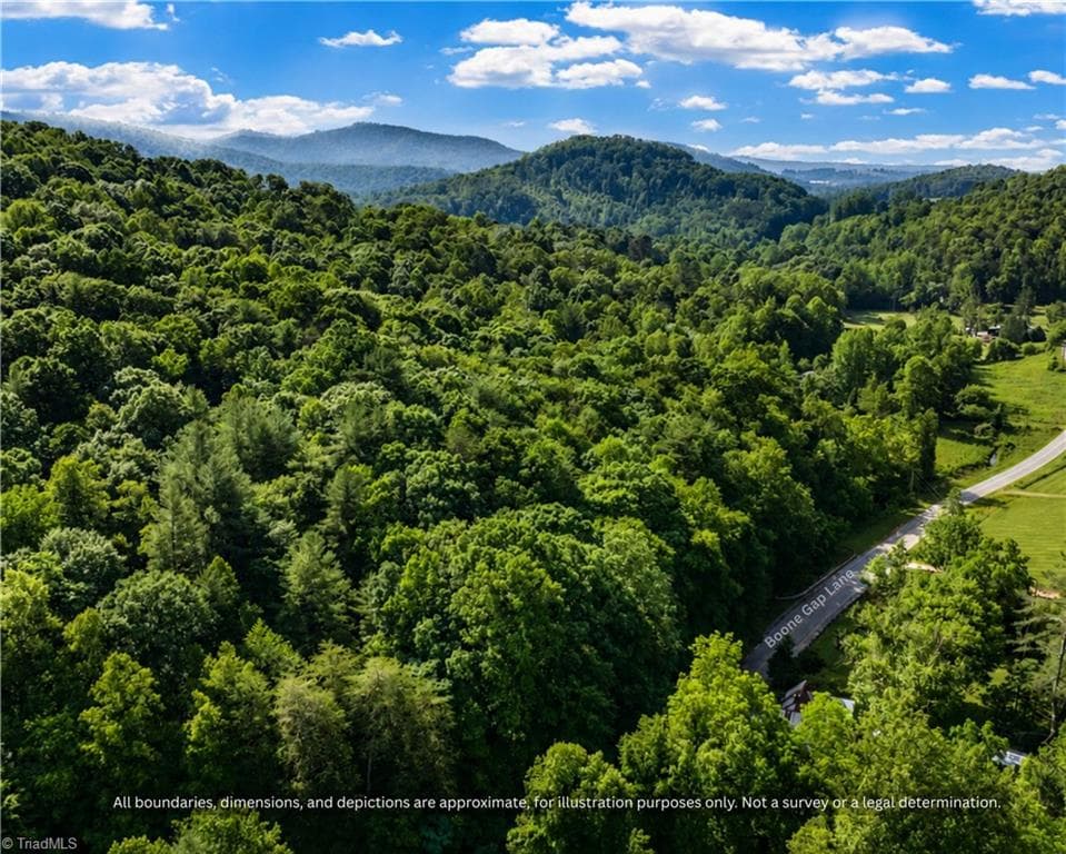 Aerial view of the paved road and wooded acreage, a quiet homesite near Taylorsville - 99999 Boone Gap Lane, Taylorsville NC 28681, Taylorsville