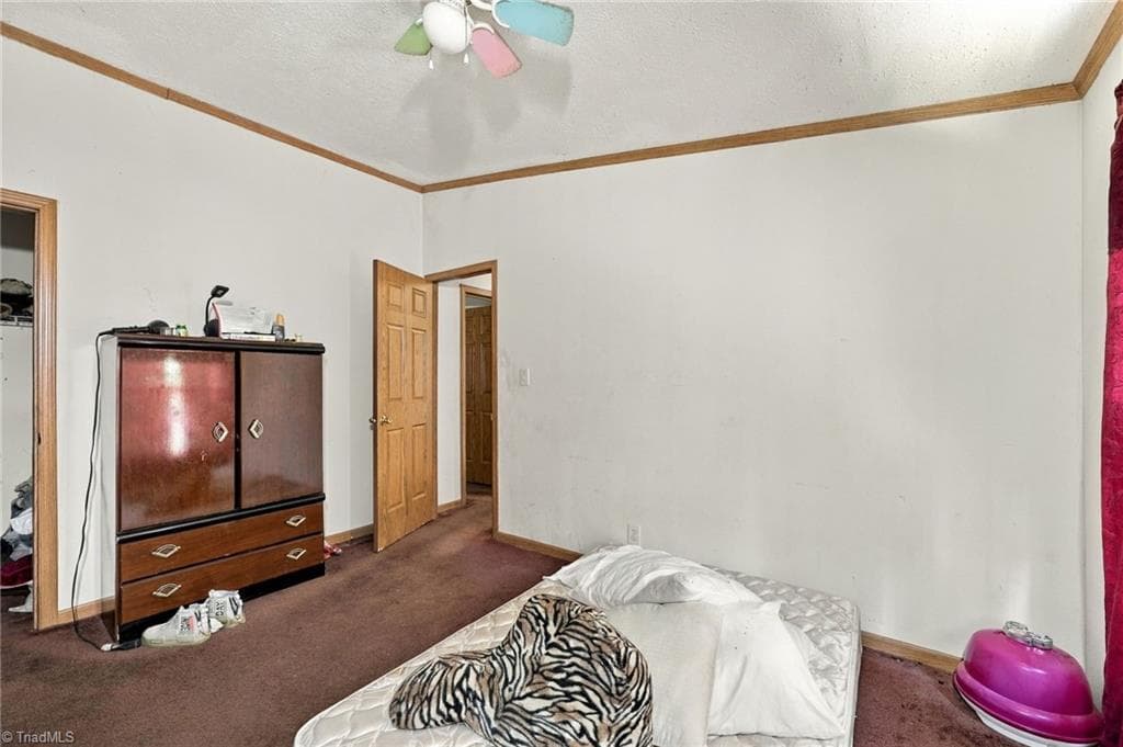 Third bedroom with ceiling fan and ample closet storage. - 415 Talley Road, Reidsville NC 27320, Reidsville