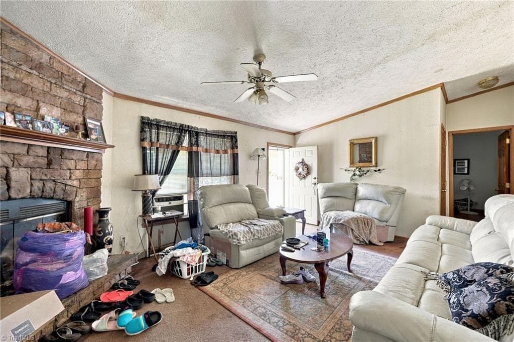 Living area with wood burning fireplace. - 415 Talley Road, Reidsville NC 27320, Reidsville