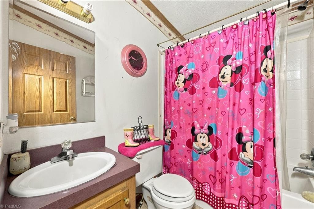 Separate full bathroom with single vanity and shower & tub combo. - 415 Talley Road, Reidsville NC 27320, Reidsville