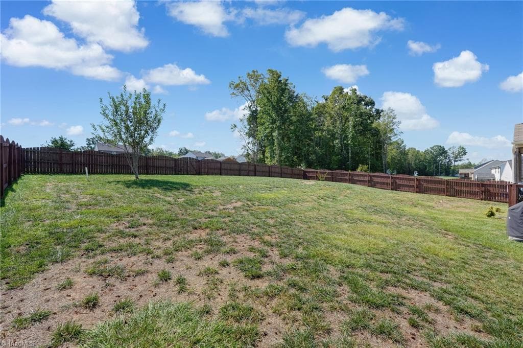 Back yard view from the patio. - 1466 Kernodle Landing Drive, Burlington NC 27217, Burlington
