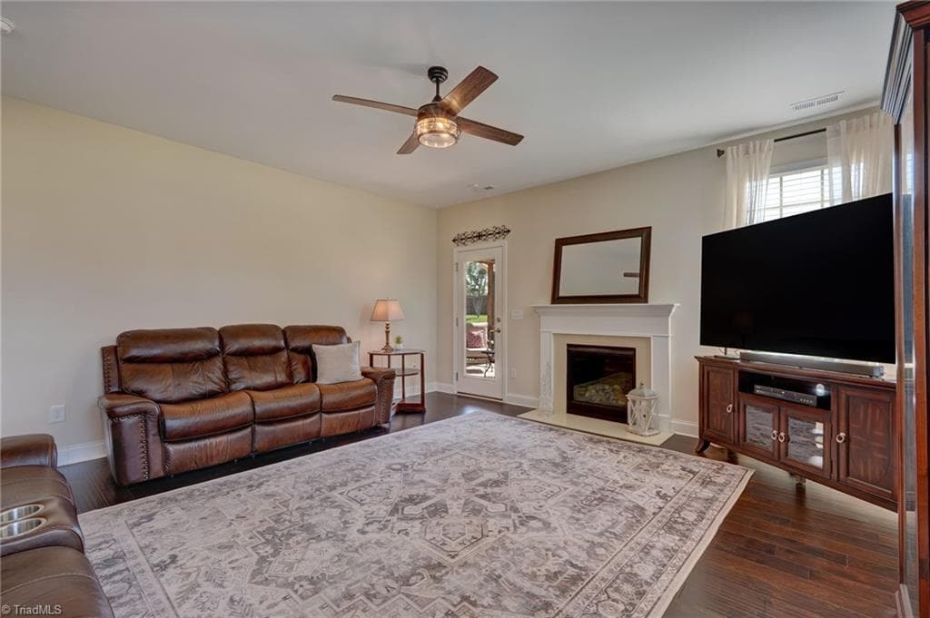 Gas-log fireplace with blower creates a cozy focal point for cool evenings - 1466 Kernodle Landing Drive, Burlington NC 27217, Burlington