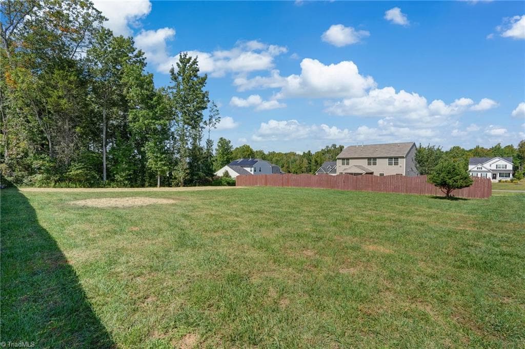 Acreage goes well beyond the beautiful wooden fenced in yard. - 1466 Kernodle Landing Drive, Burlington NC 27217, Burlington