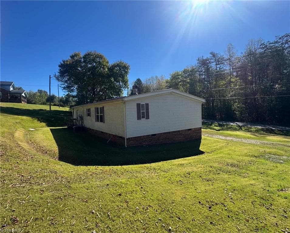 Manufactured Home at 256 Brookfall Dairy Road, Elkin NC 28621, photo 5 of 25