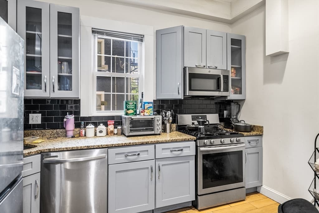 3 Family at 50 Perrin St, Boston MA 02119, photo 3 of 35