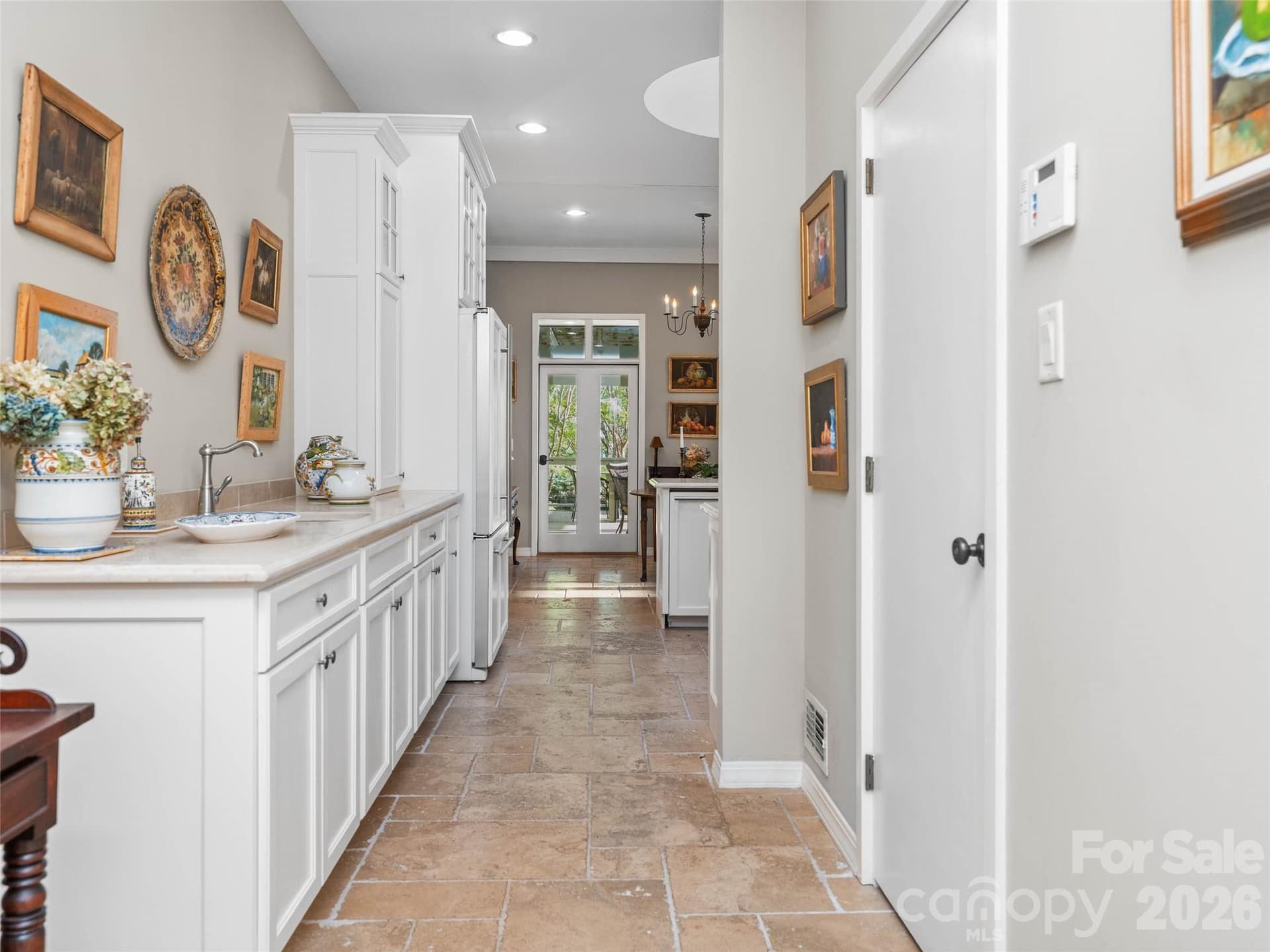 The kitchen opens gracefully to porch living and the heart of the home - 65 Crestwood Road, Asheville
