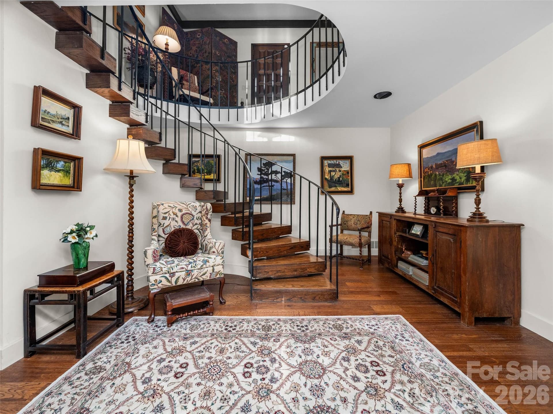 Surrounded by windows and views from every angle, the staircase connects the beauty of the outdoors with the warmth of the home within. - 65 Crestwood Road, Asheville