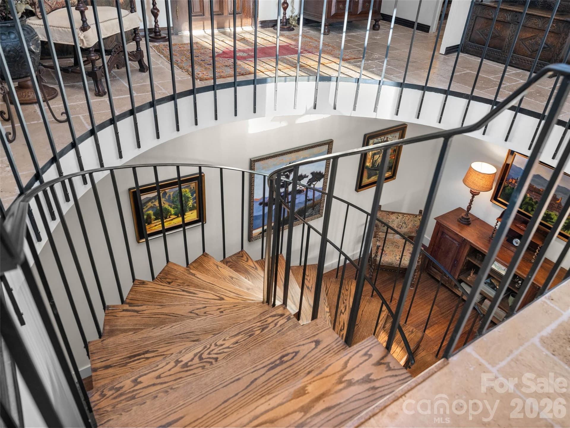 Sweeping stairway connects the main floor to lower level - 65 Crestwood Road, Asheville