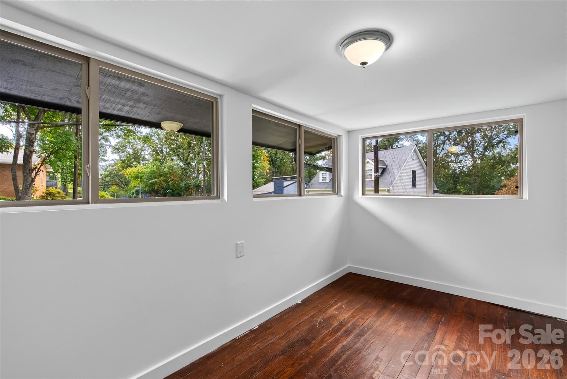 Upstairs sunroom is not counted in HLA because the ceiling is 6'6". Would make a great closet or office. - 64 and 56 Pine Cone Drive, Asheville