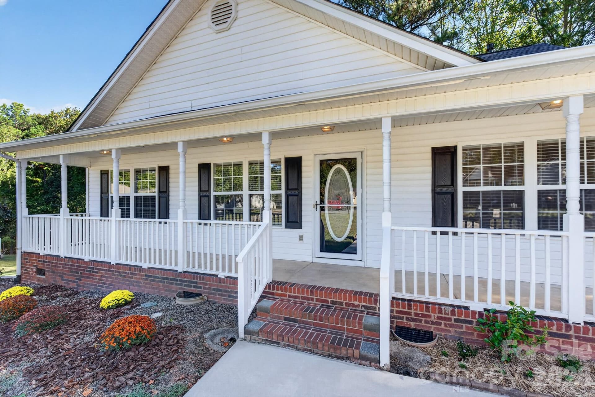 Expansive wrap-around style covered front porch—perfect for rocking chairs, morning coffee, and relaxing outdoors. - 702 Painted Lady Court, Rock Hill