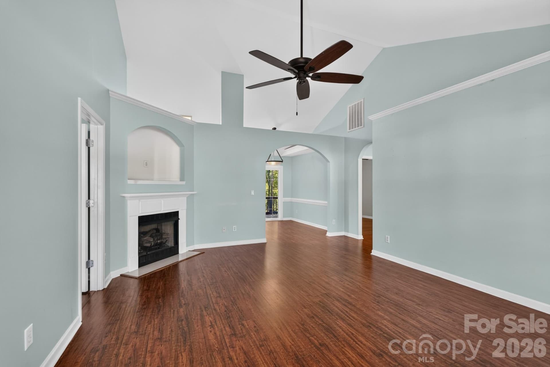 Interior accents and continuous hardwood flooring elevate the sense of airiness throughout. - 702 Painted Lady Court, Rock Hill
