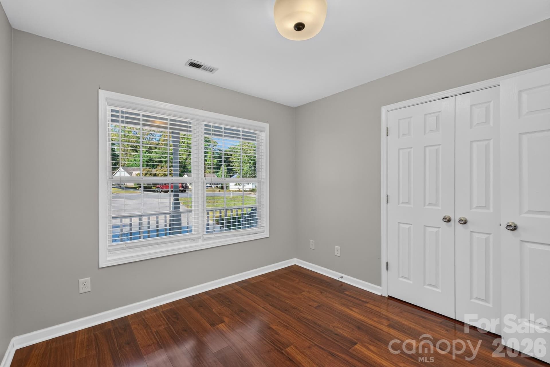 Double-door closet storage keeping your living space tidy and functional. - 702 Painted Lady Court, Rock Hill