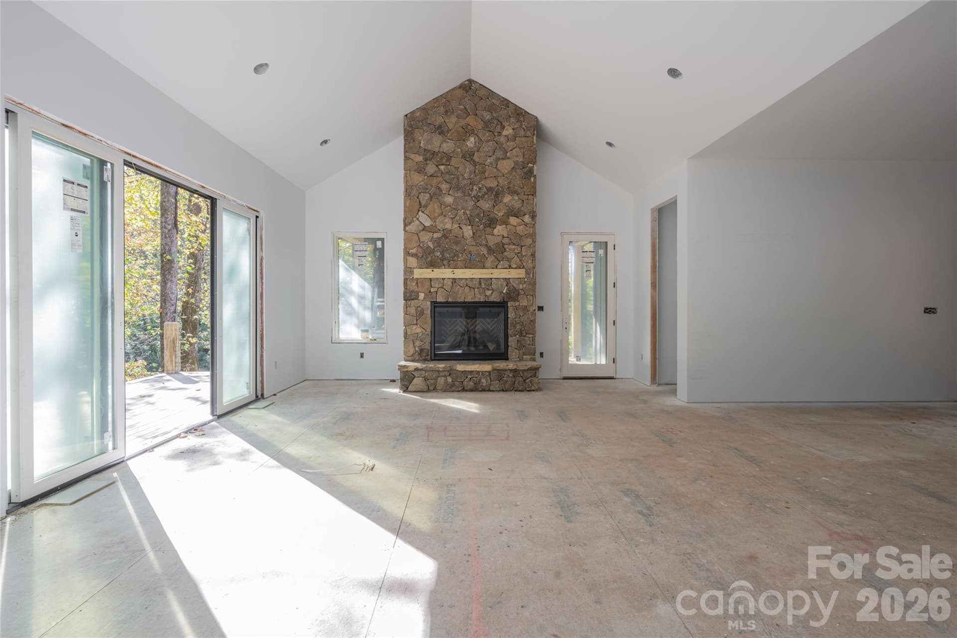 Living room highlighted by vaulted ceiling and gas fireplace - 200 Bent Pine Trace, Hendersonville