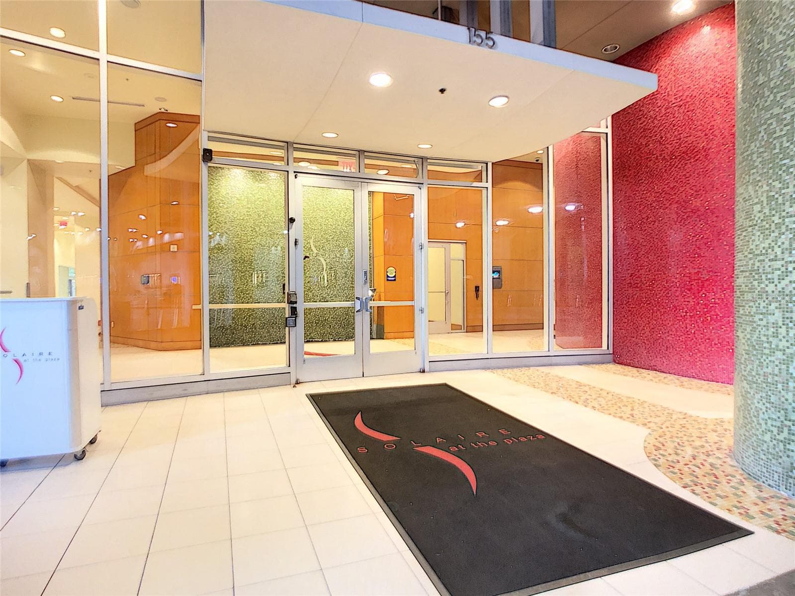 Covered entry with security features and doorman. - 155 S COURT AVE #2107, ORLANDO