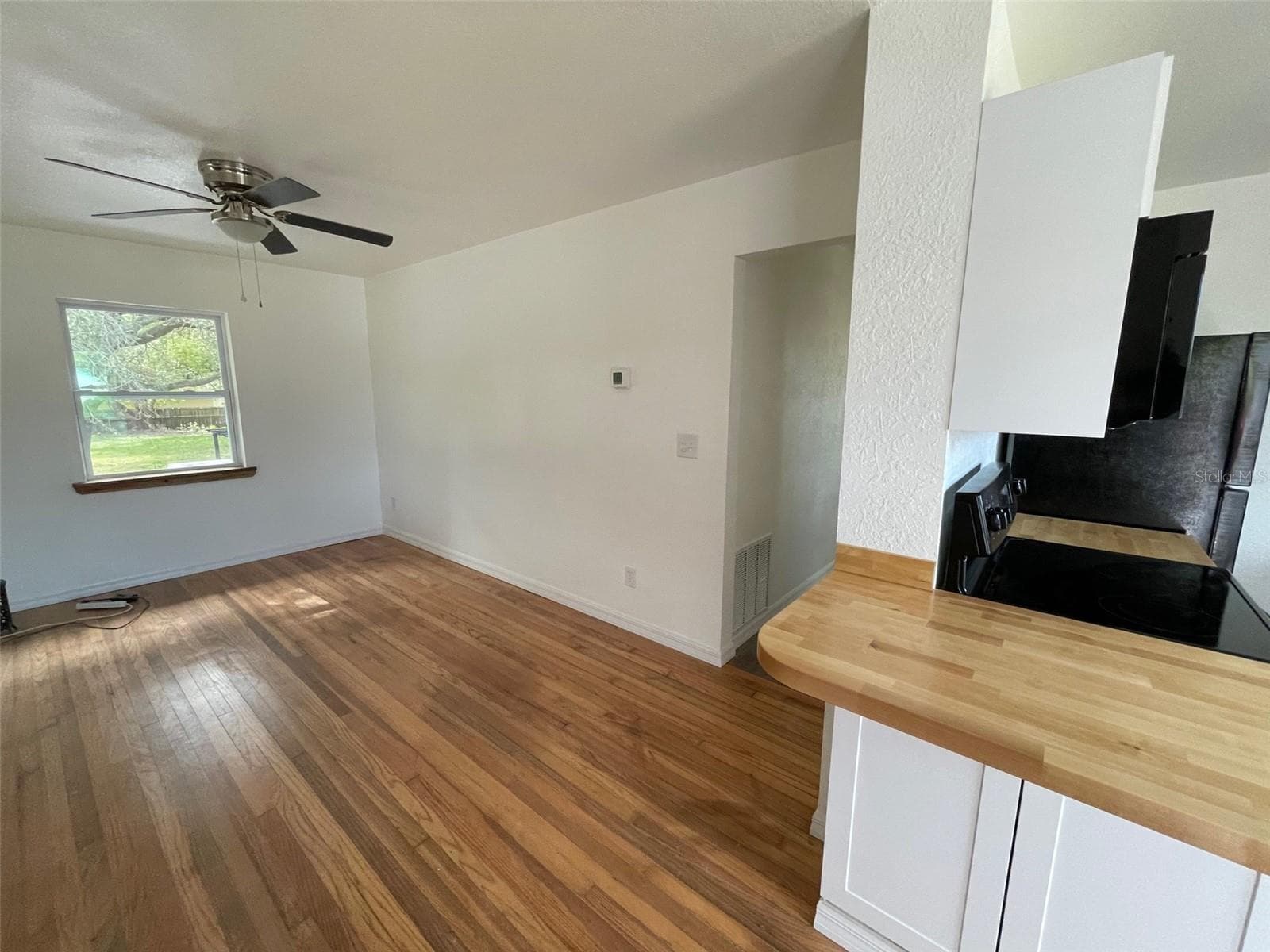 Living room. Door on right leads down short hallway to 2 bedrooms and 1 bathroom, - 5370 71ST ST N, ST PETERSBURG