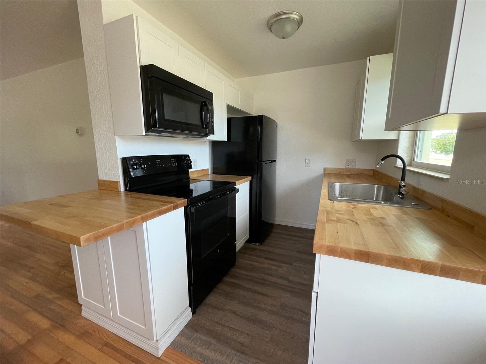 Looking into kitchen from front entry door, - 5370 71ST ST N, ST PETERSBURG