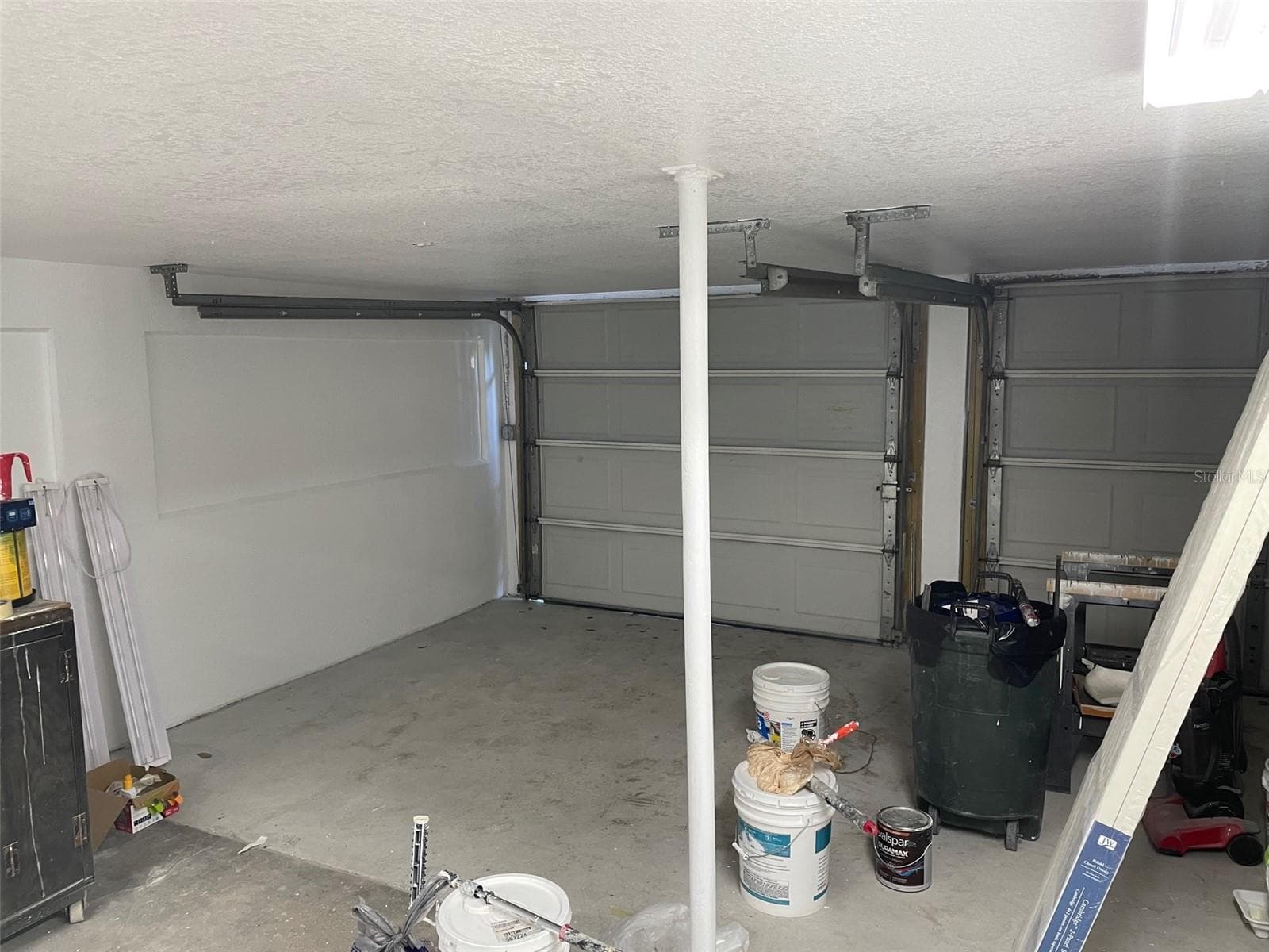 Garage with 1 full parking space and 1 half space (on right) which would fit a Smart Car or golf cart. - 5370 71ST ST N, ST PETERSBURG