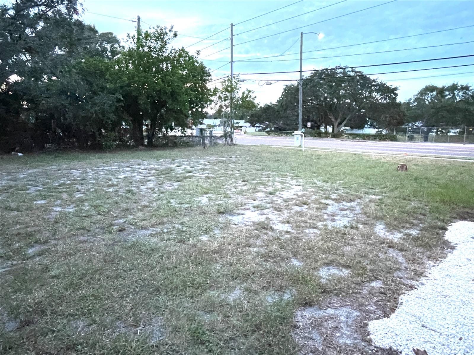 looking across Lot 12 towards 54th Ave N from the back of the house - 5370 71ST ST N, ST PETERSBURG