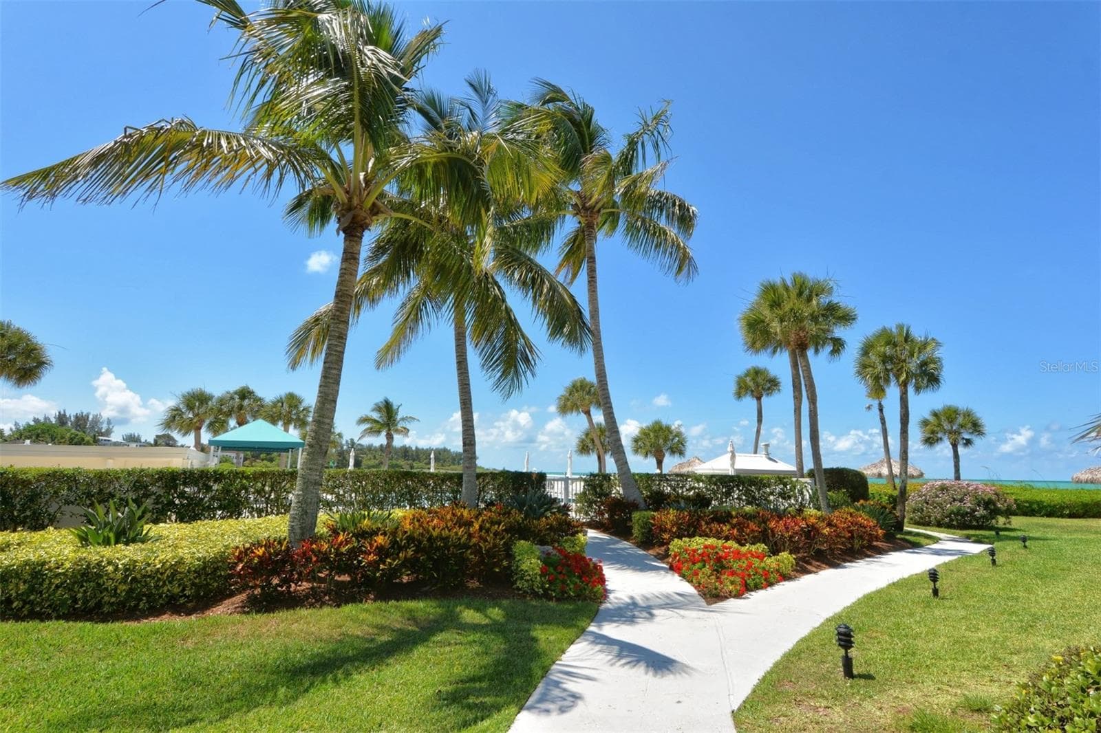 Grounds walkway to pool area - 100 SANDS POINT RD #324, LONGBOAT KEY