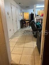 3 . Front Door toward Kitchen dining area and Back Door View - 1603 ROSE LN, EUSTIS