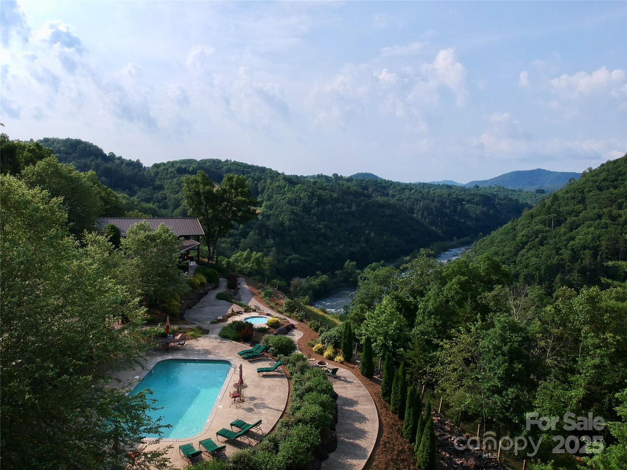 Relax at the River Lodge pool and hot tub with vast mountain and river views! - Marshall