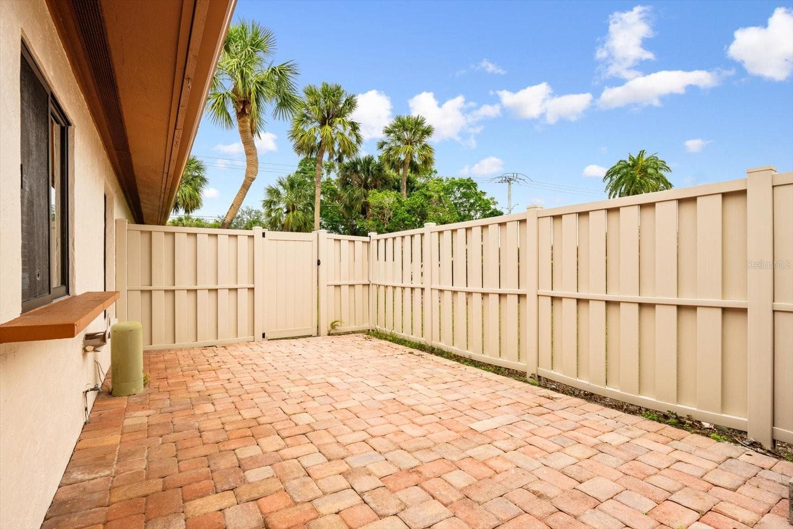 SIDE COURT YARD OFF KITCHEN - 6401 PELICAN DR #80A, BRADENTON