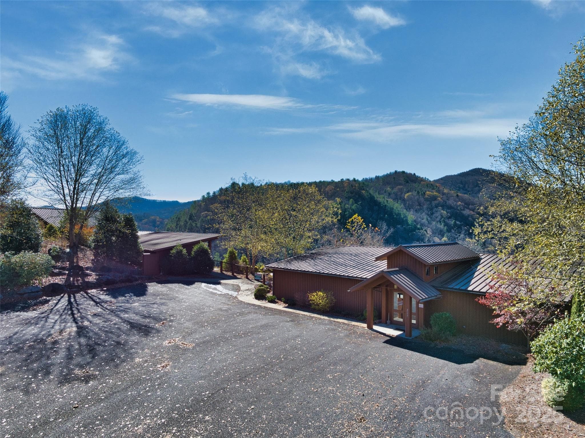 Clubhouse and fitness center overlooking the French Broad River and the mountains beyond - Marshall