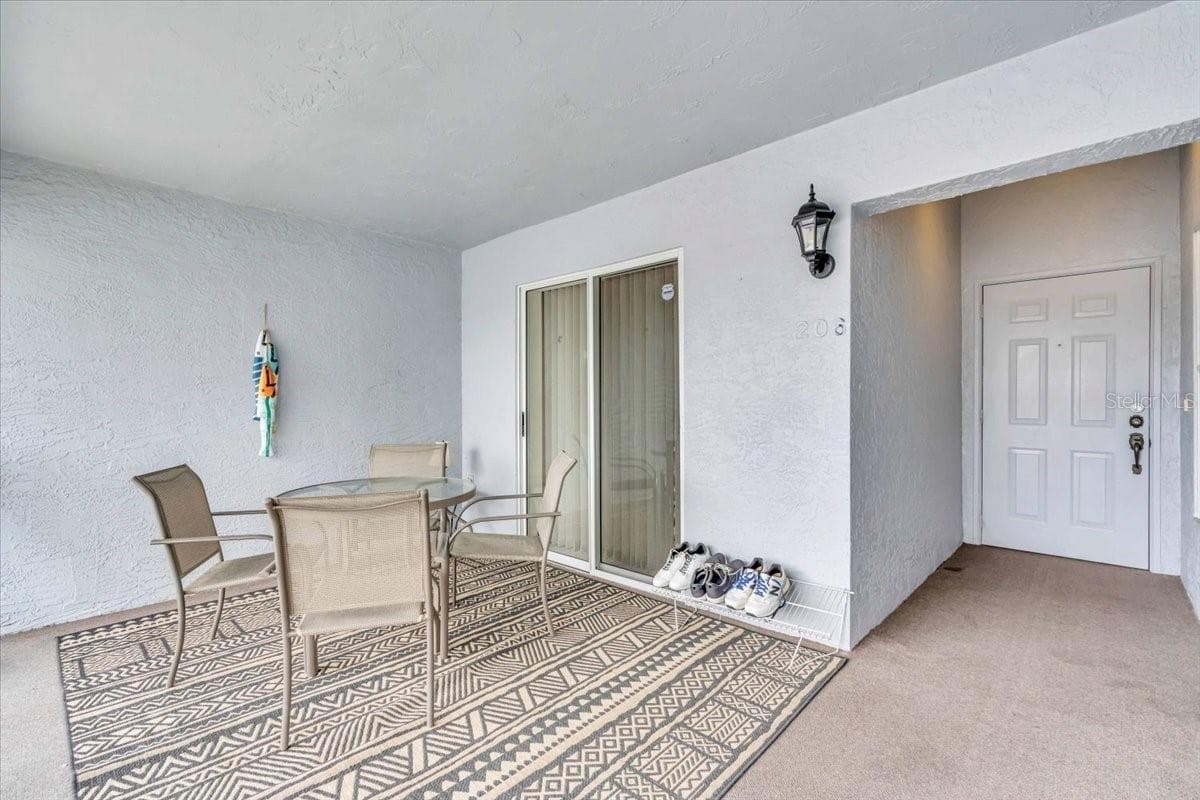 large front porch area - 6713 STONE RIVER RD #206, BRADENTON
