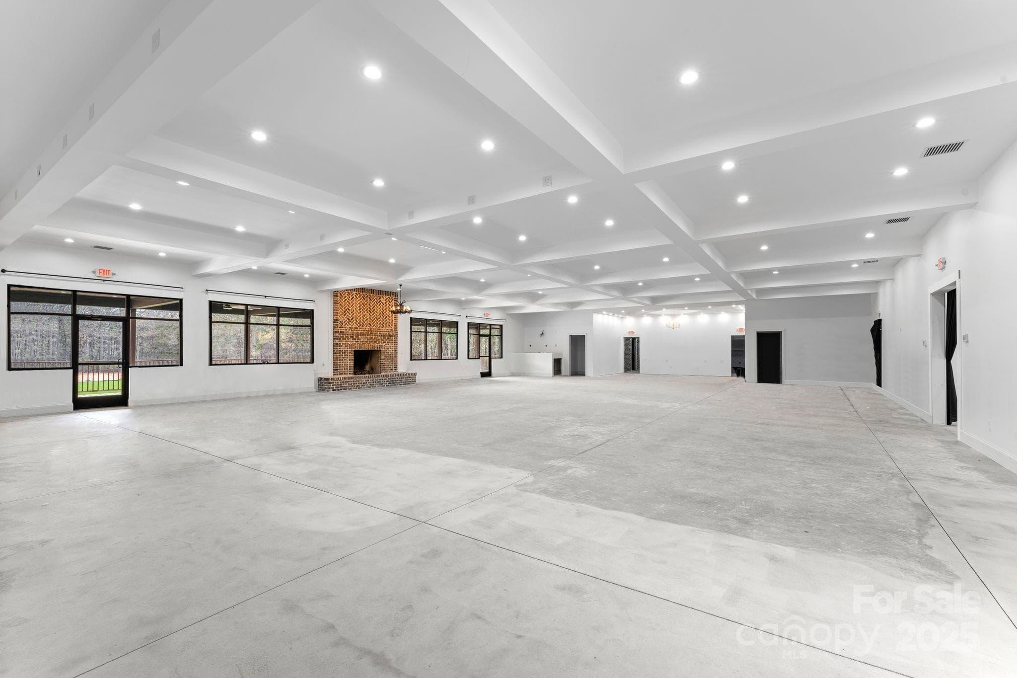 Open entertaining interior space with possible grooms area and brides area - 1565 Shinnville Road, Cleveland