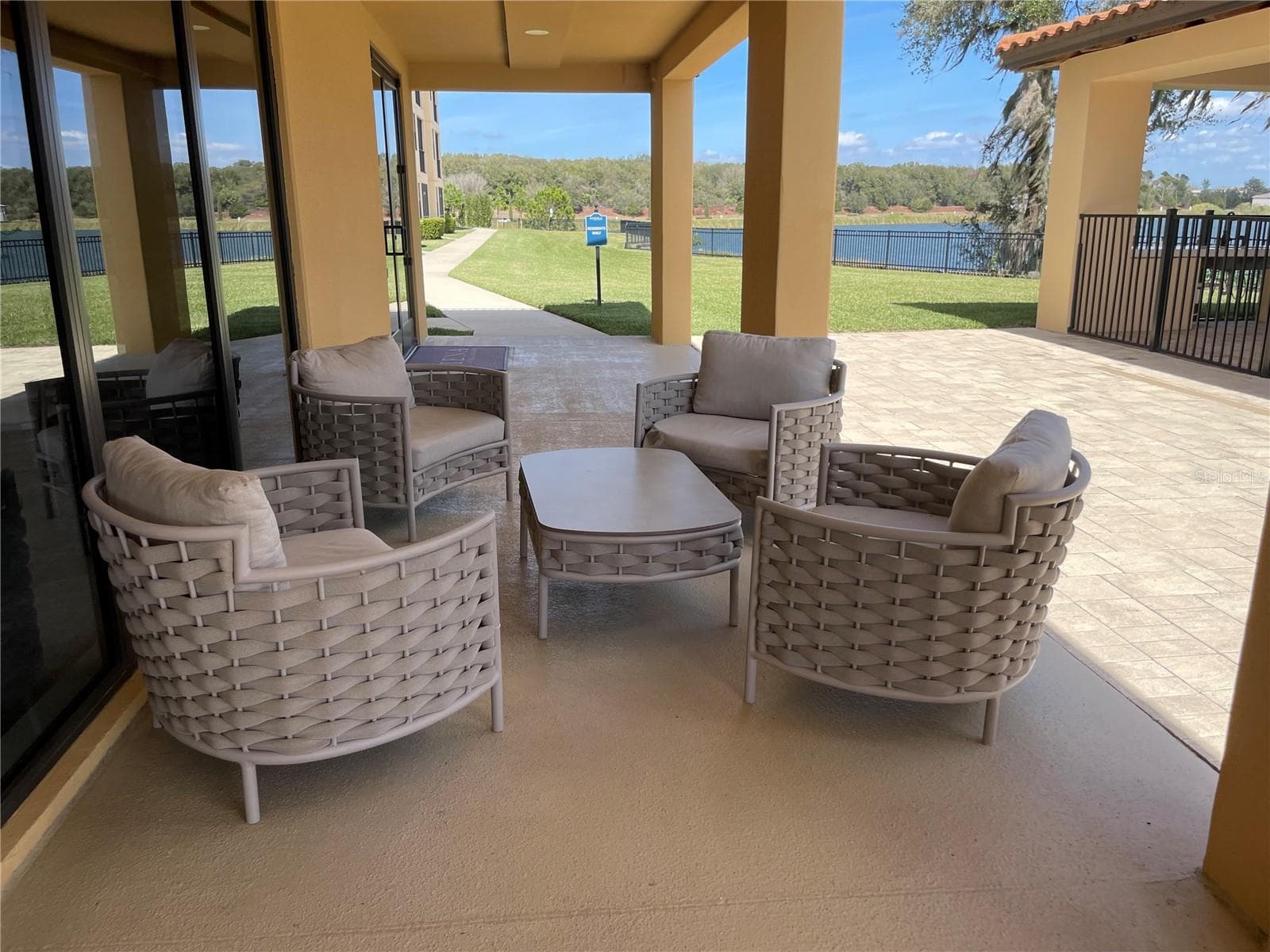 Outdoor Lounge area by pool and lake. One of two. - 16300 COUNTY ROAD 455 #305, MONTVERDE