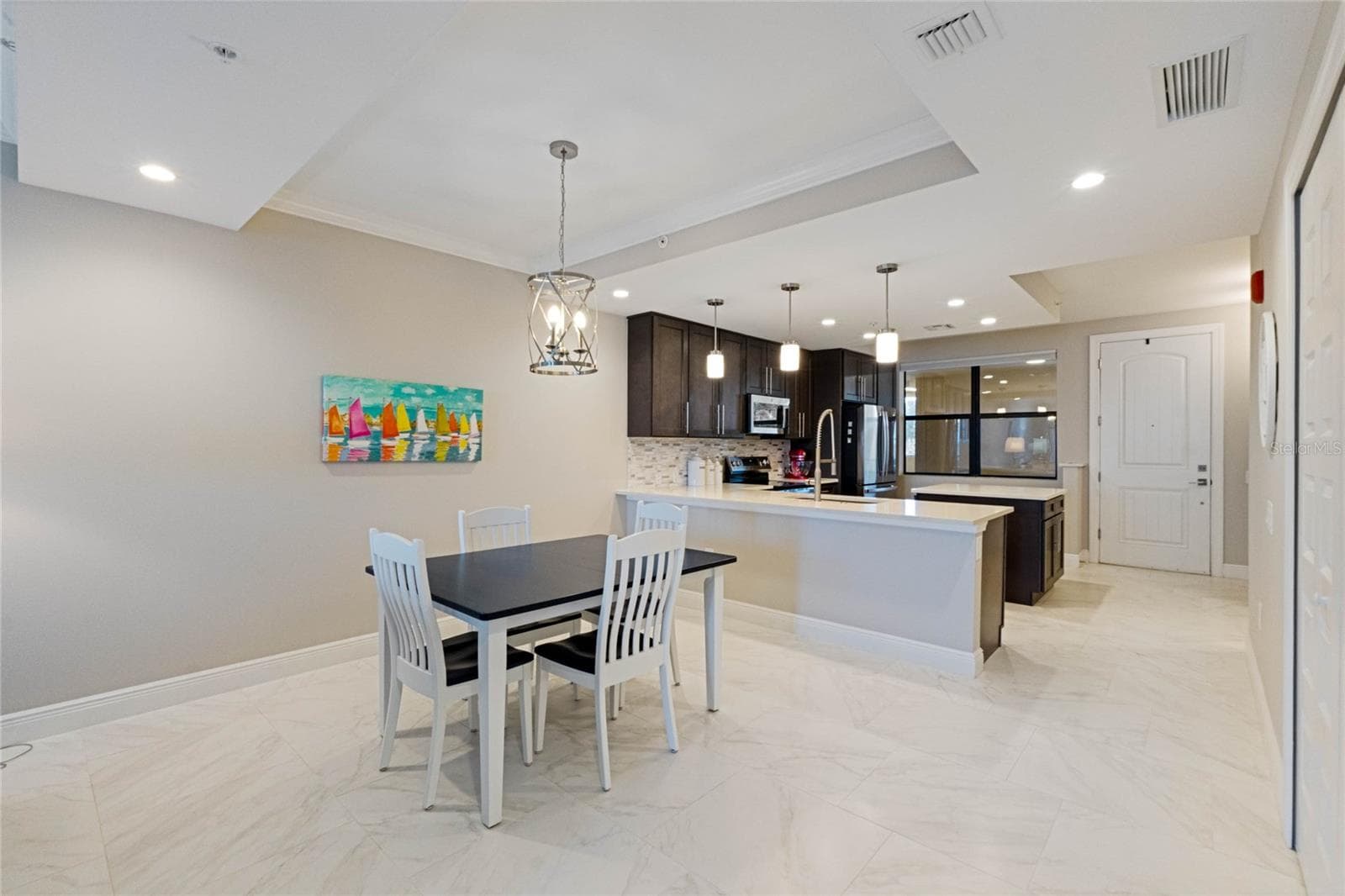 View of dining area to kitchen. - 16300 COUNTY ROAD 455 #305, MONTVERDE