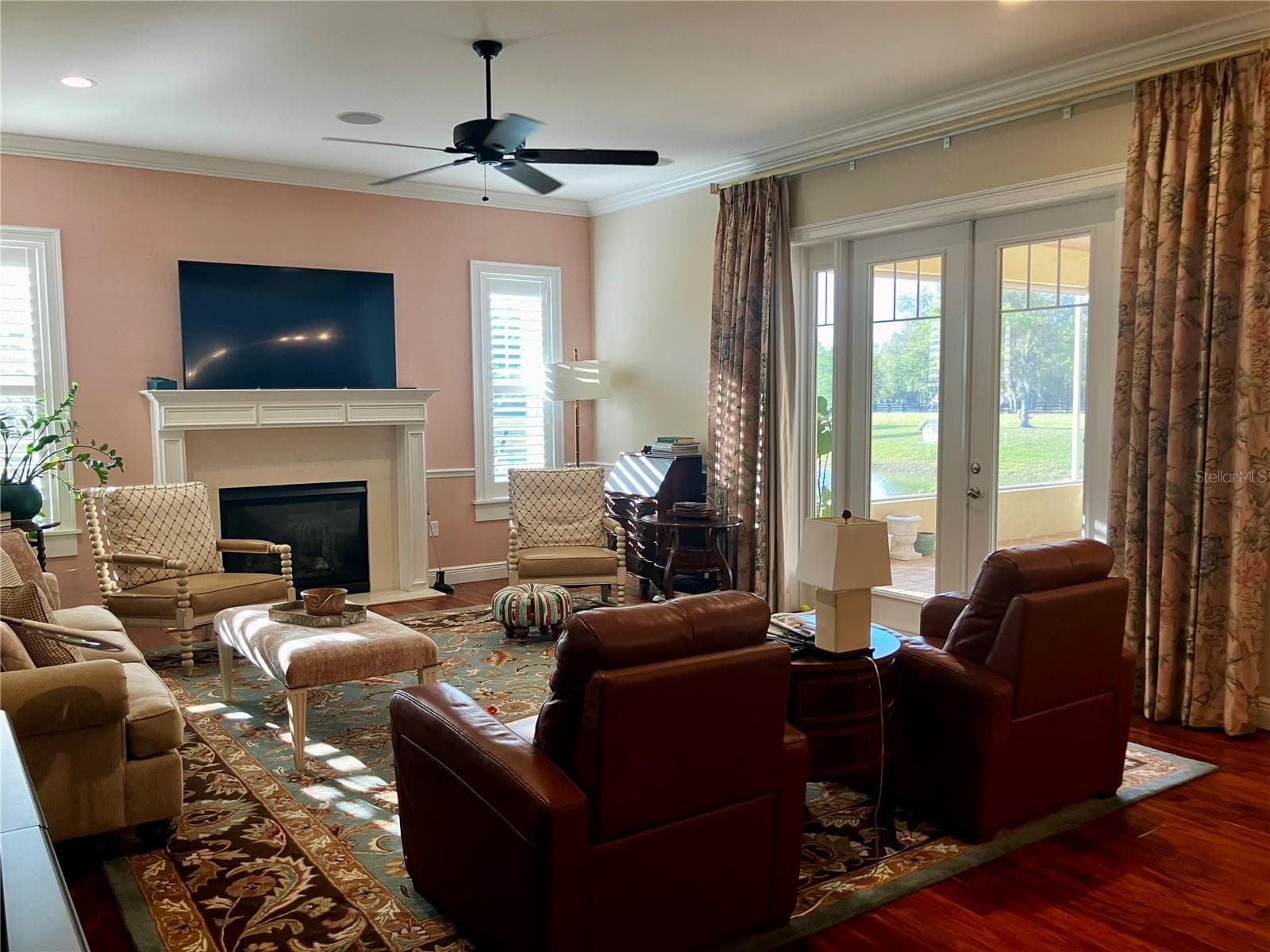 Family room with views of the pond. Curtains do not convey. - 3709 GALLAGHER RD, PLANT CITY
