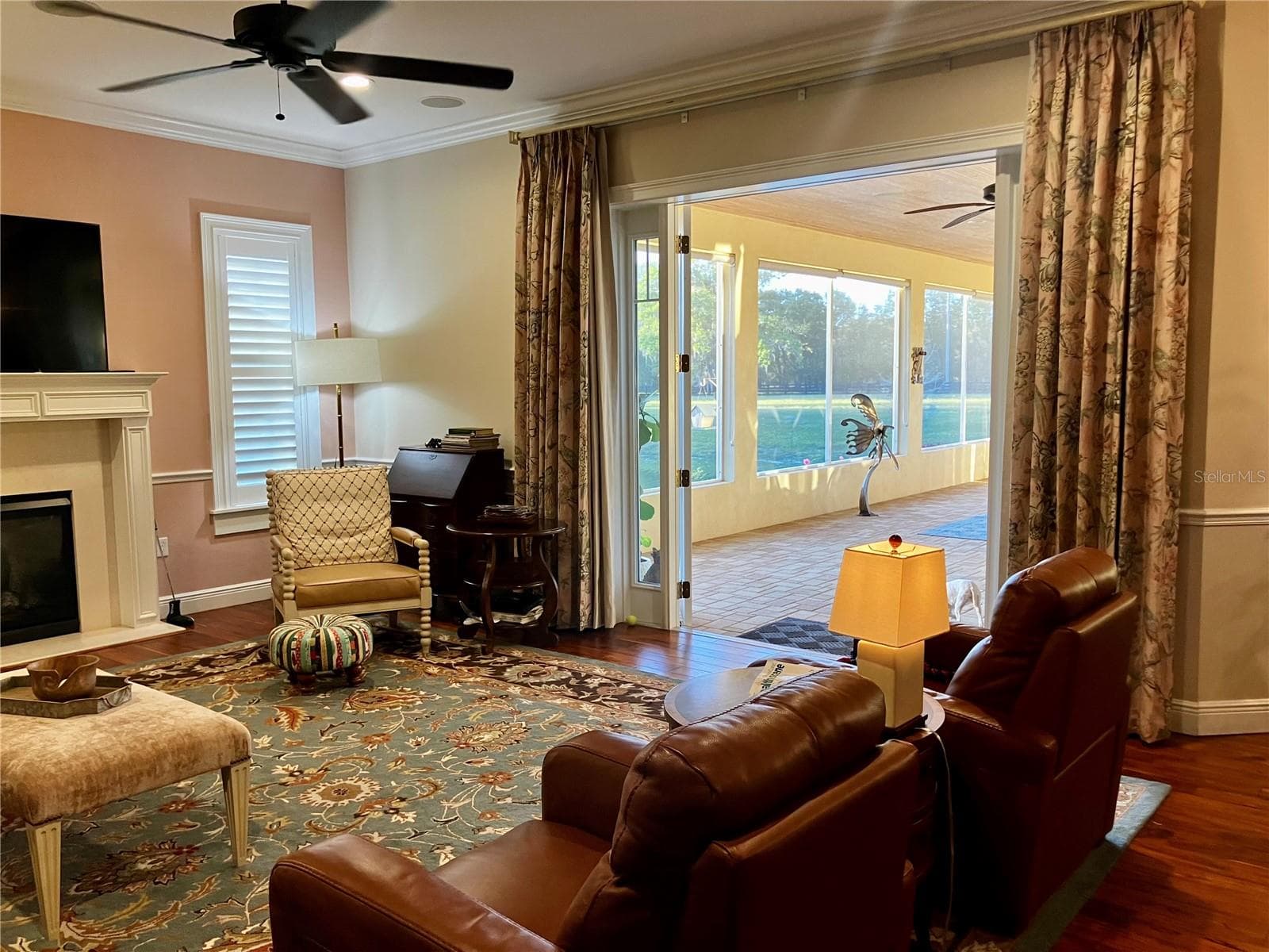Family room opens up to screened porch. Curtains do not convey. - 3709 GALLAGHER RD, PLANT CITY