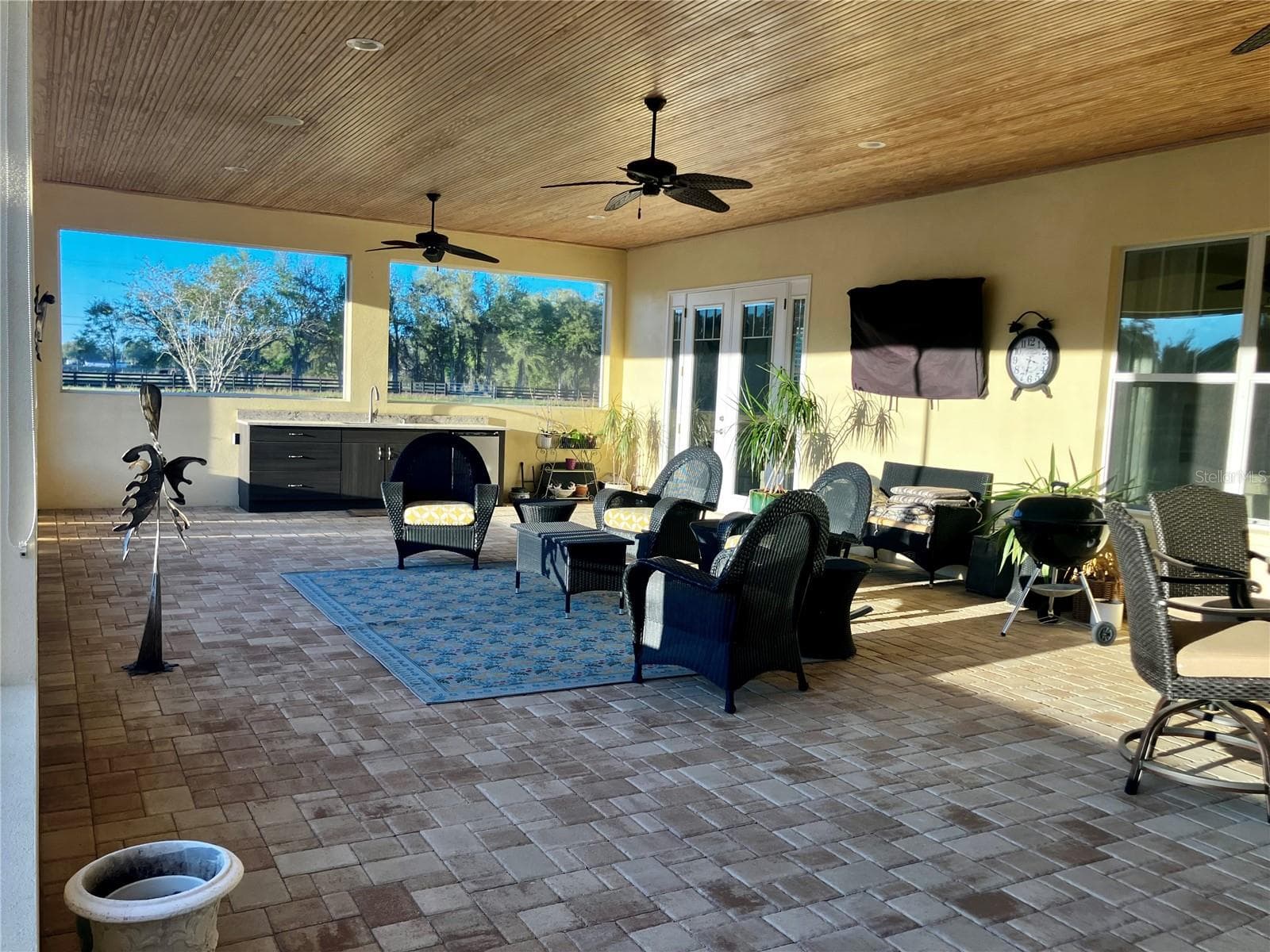 Enclosed screened porch with finished wood ceiling and wet bar - 3709 GALLAGHER RD, PLANT CITY