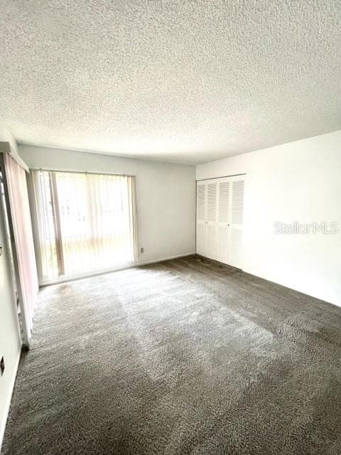 Bedroom 2 has patio access and 2 closets - 2538 CITRUS CLUB LN #105, ORLANDO