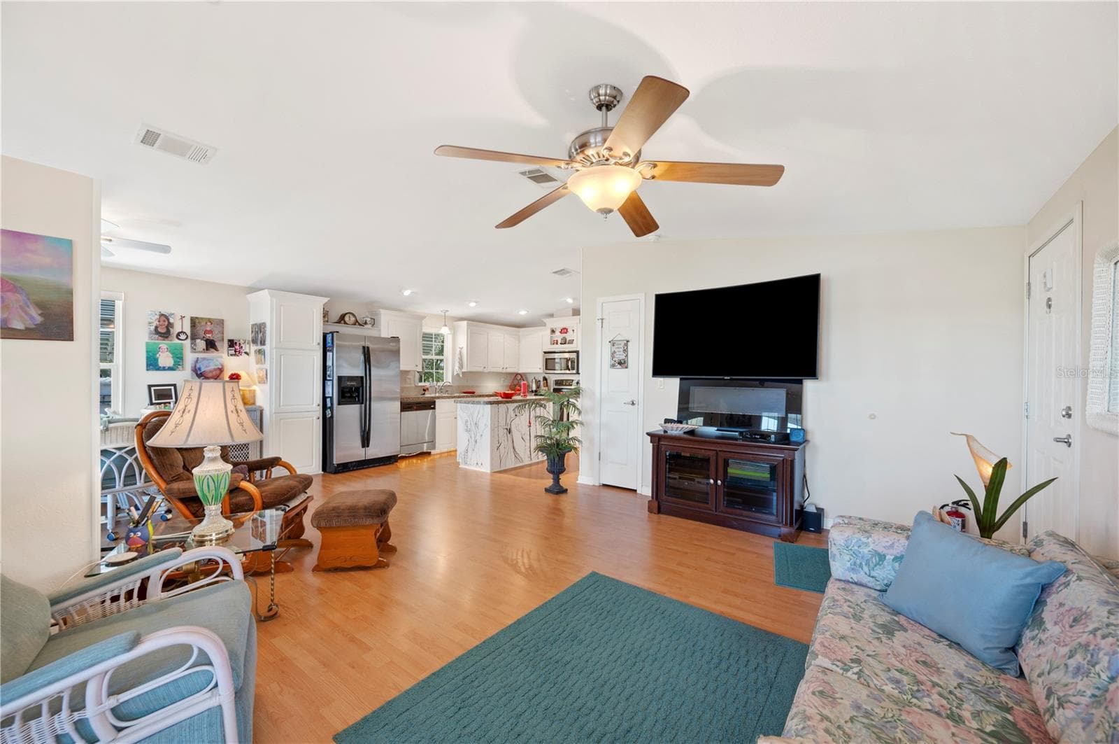 Living room open up to the dining room and kitchen - 38 QUEEN OF WATERS ST, LAKE WALES