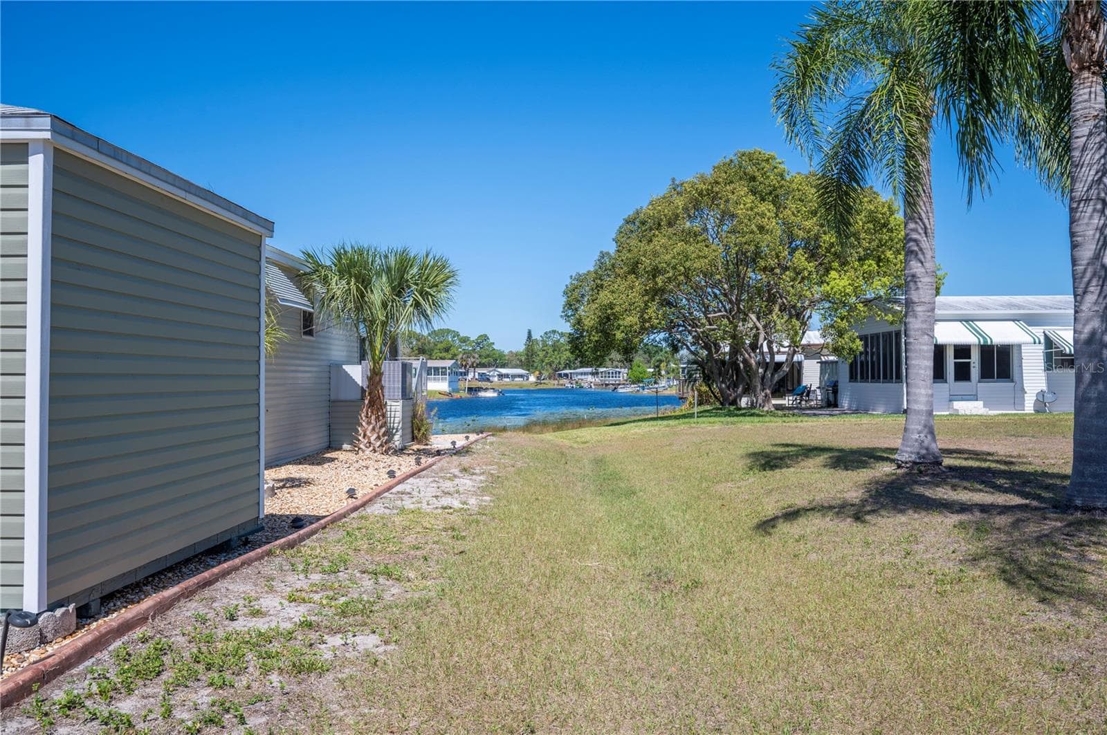 Side yard/ greenway - giving you the feeling of more space - 38 QUEEN OF WATERS ST, LAKE WALES
