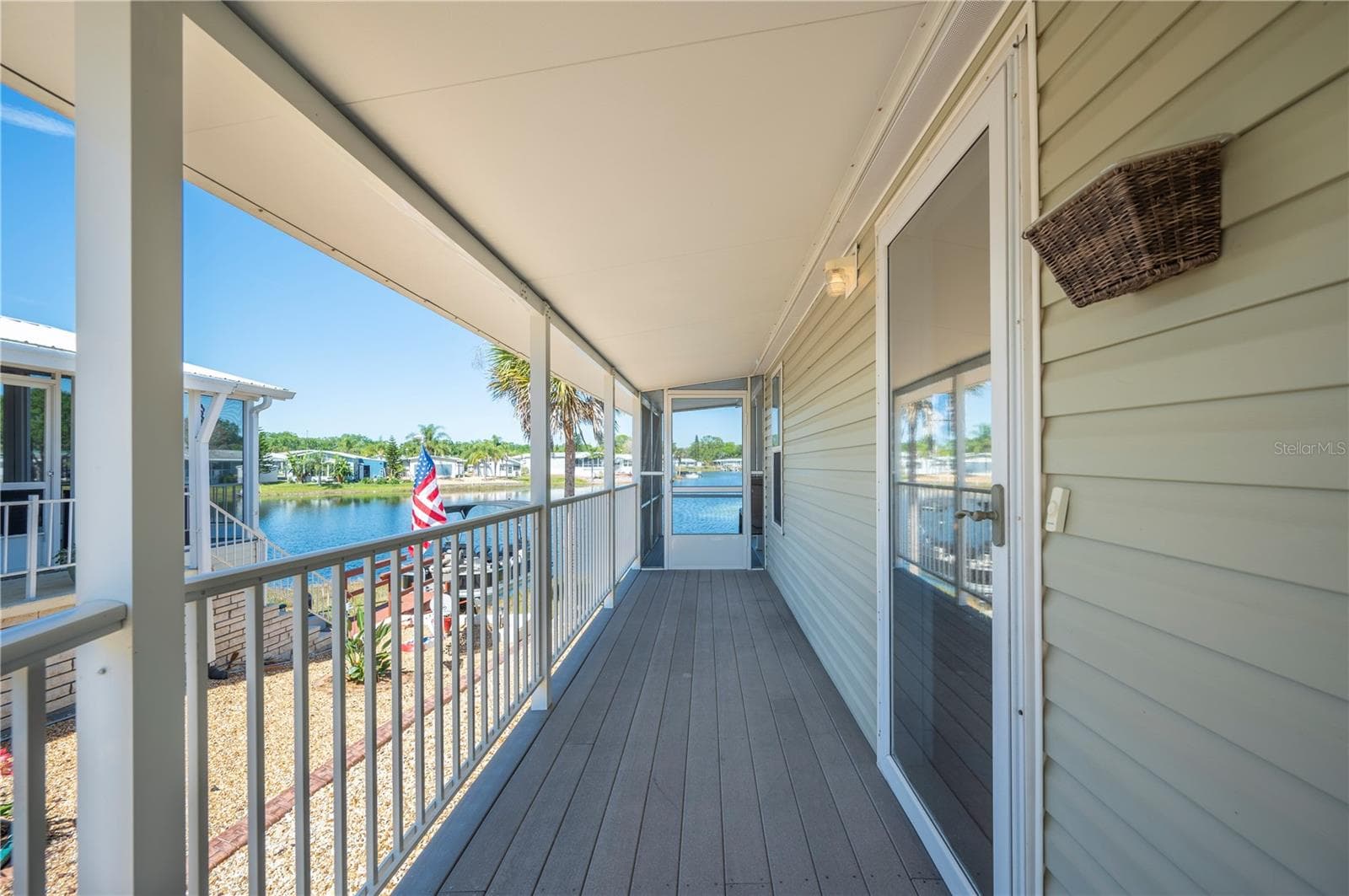 Side porch, with ramp, making it easy access to your home or porch! - 38 QUEEN OF WATERS ST, LAKE WALES