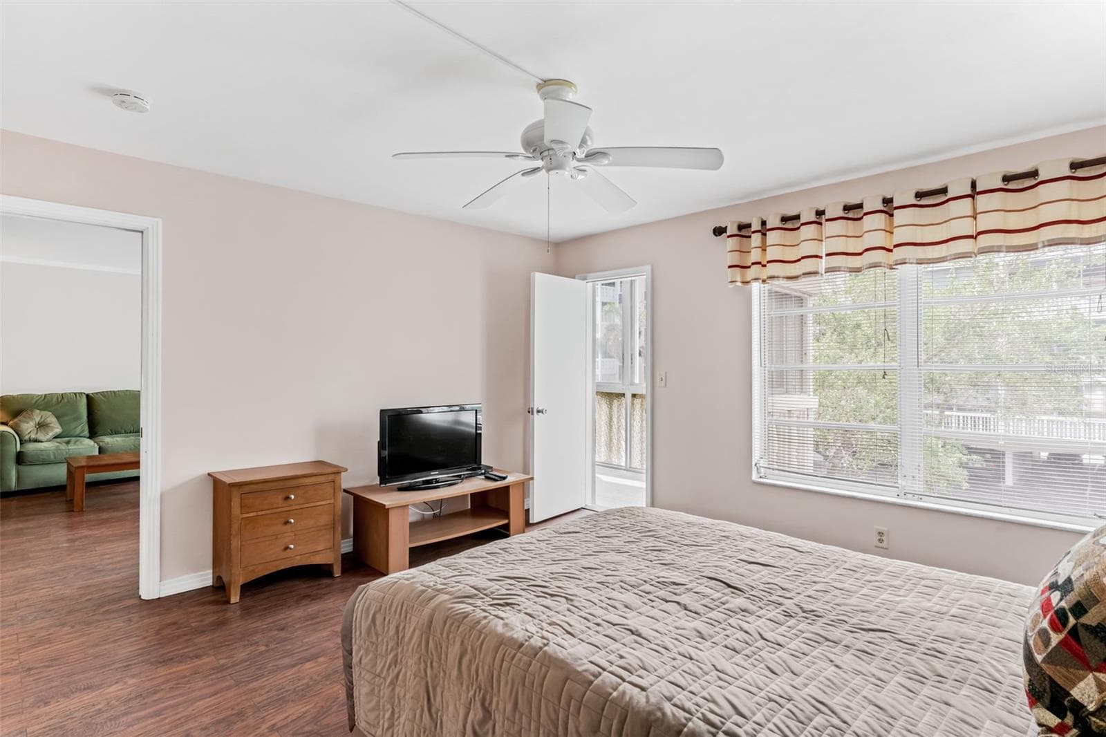 Primary bedroom with balcony access - 147 BLUFF VIEW DR #206, BELLEAIR BLUFFS