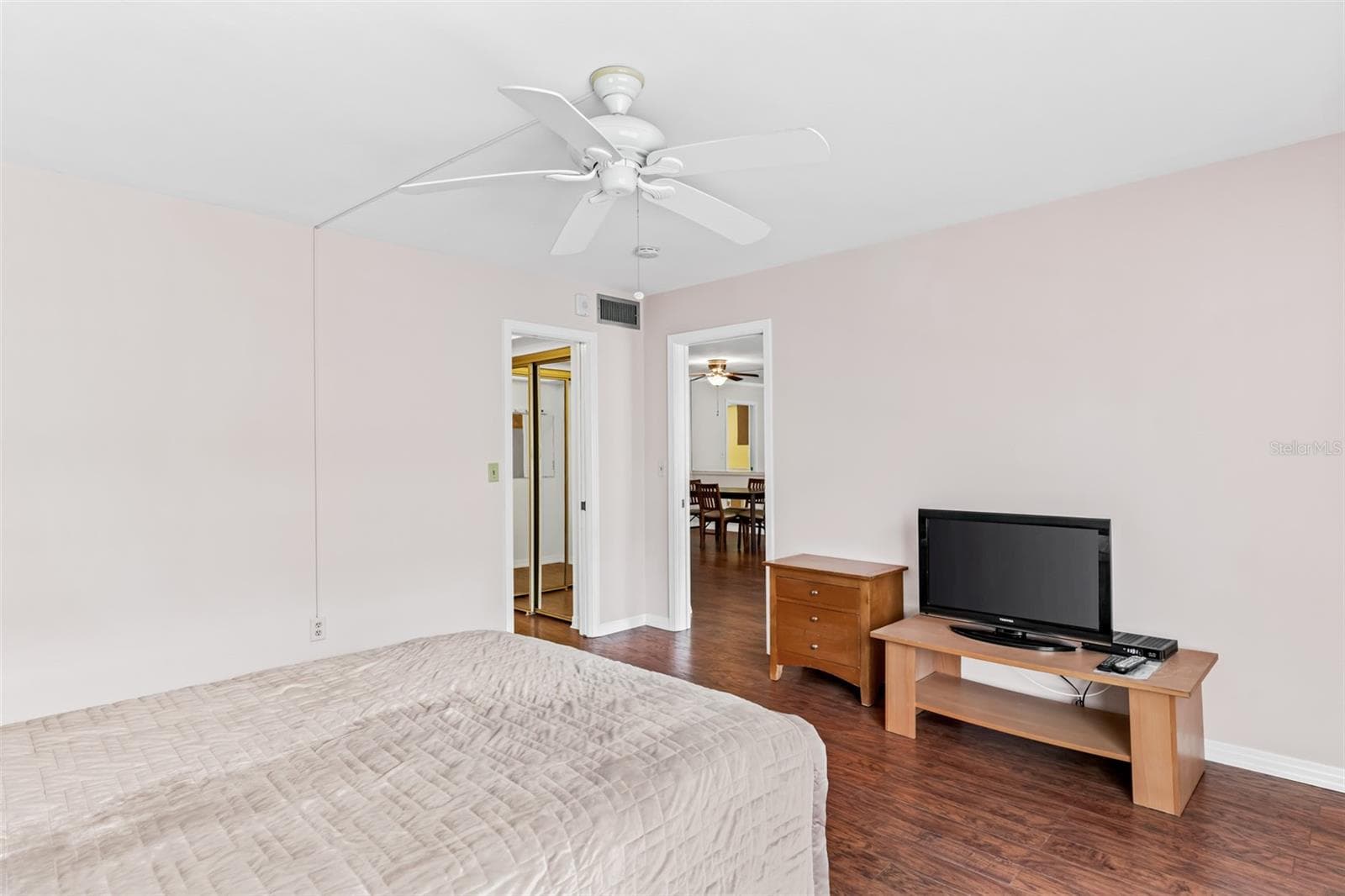 Primary bedroom with balcony access - 147 BLUFF VIEW DR #206, BELLEAIR BLUFFS