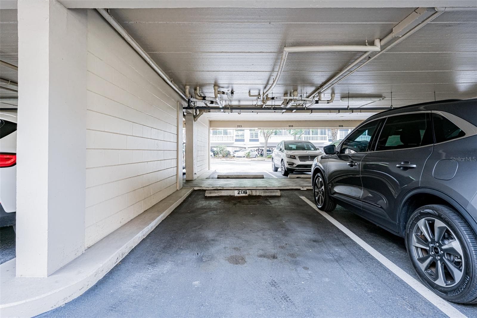 Covered parking - 147 BLUFF VIEW DR #206, BELLEAIR BLUFFS
