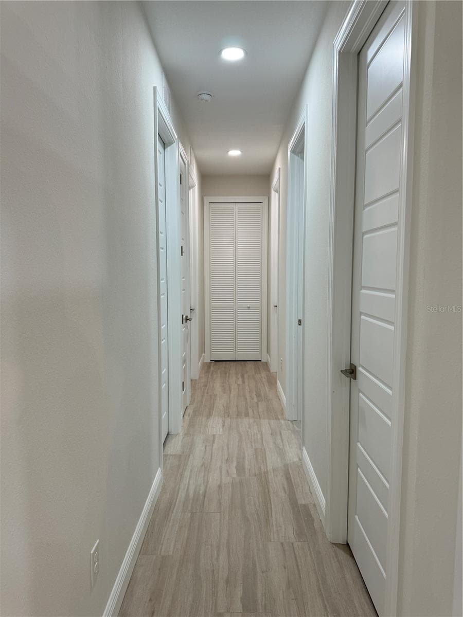 Hallway to Bedroom 1 & 2, Linen Closet, Pantry, & Utility Room - 20296 RUTHERFORD AVE, PORT CHARLOTTE