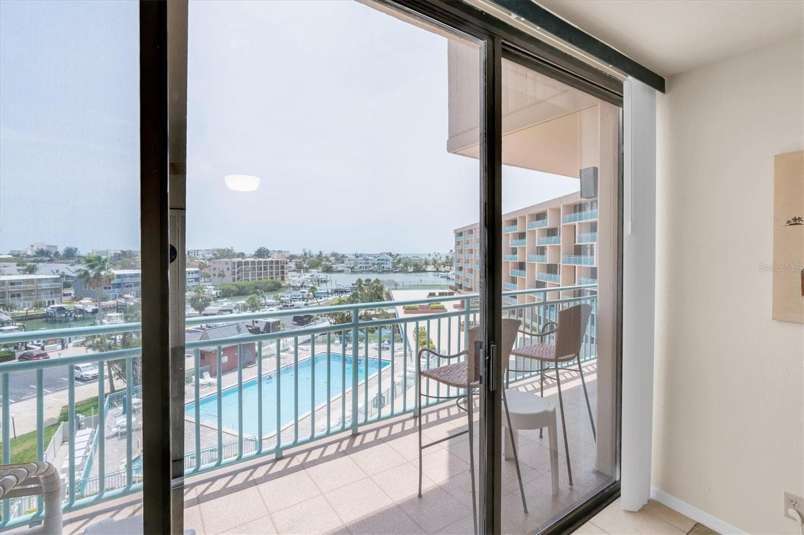 Living Room View - OPENS to Balcony - Southerly exposure w/views of Bay & Gulf in distance! - 1 KEY CAPRI #502E, TREASURE ISLAND