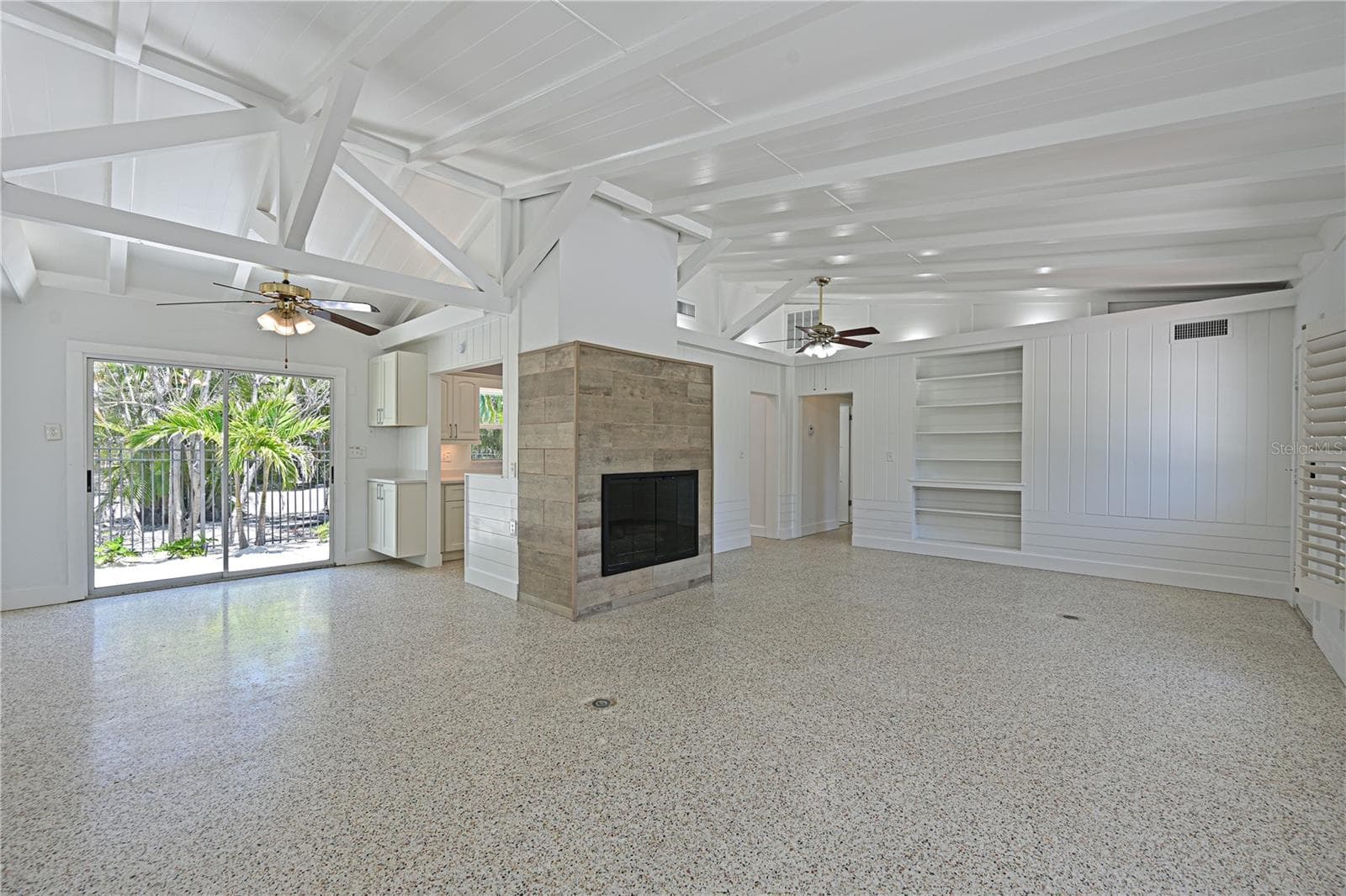 Dining room, living room & gas fireplace - 5924 GULF OF MEXICO DR, LONGBOAT KEY