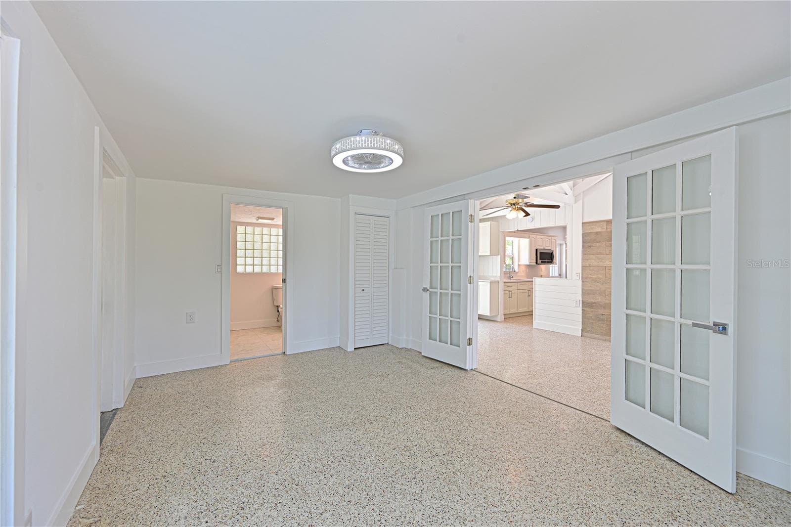 Family room french doors - 5924 GULF OF MEXICO DR, LONGBOAT KEY